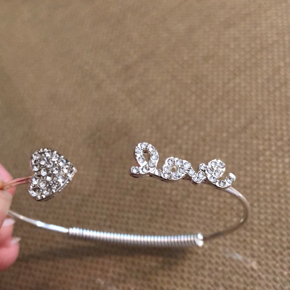 Adjustable silver “love” bracelet